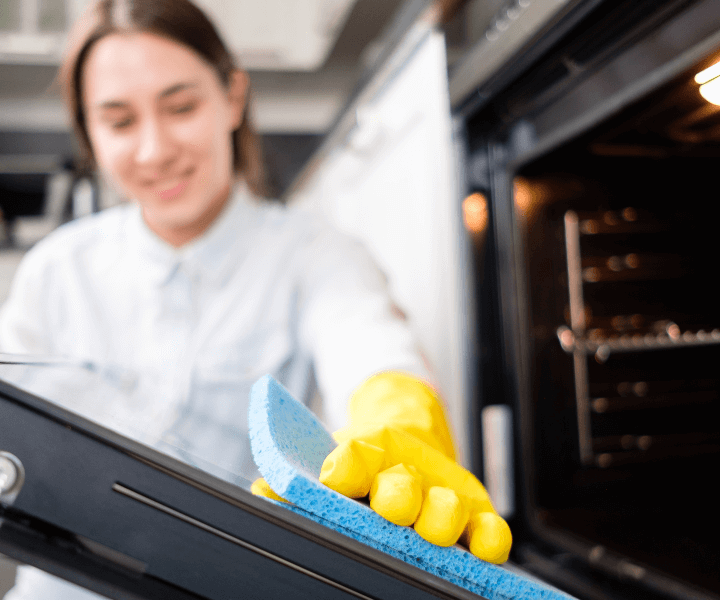 Deep clean of an oven by a woman at Chloe's Cleaning Company at Thornton