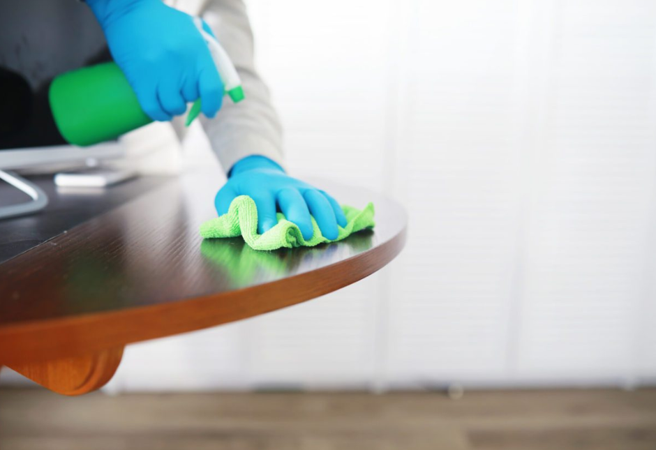 cleaning a table white a water spray